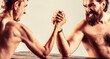 © Yevhen - Arms wrestling thin hand, big strong arm in studio. Two man's hands clasped arm wrestling, strong and weak, unequal match