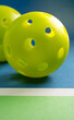 Close up of pickleball balls on court