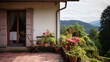 Maison de village dans la campagne alsacienne avec terrasse fleurie, salon de jardin et vue sur les montagnes