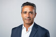 © SITI - Happy mid aged older business man executive standing on isolated, Smiling 50 year old mature confident professional manager, confident businessman investor looking at camera headshot close up portrait