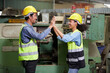 © offsuperphoto - workers or engineers giving high five pose in the factory