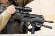 Israeli assault rifle or machine gun in Israeli soldier's hands close up