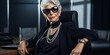 Success of stylish elderly businesswoman in black office.