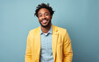 © hakule - happy handsome fashion African American man smiling and wearing color cloth, solid light color background