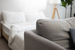 © NVB Stocker - Decorative pillow on sofa natural Fabric and bed on background