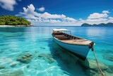 Fototapeta Na sufit - Boat in turquoise ocean water against blue sky with white clouds and tropical island