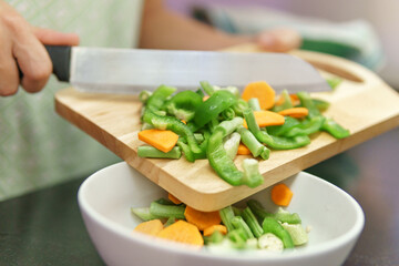 Canvas Print - Colorful view of peaces of vegetables on a cutting board