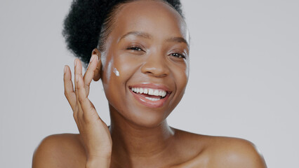 Sticker - Portrait, cream and face of black woman in studio for beauty, dermatology and aesthetic makeup on grey background. Happy model, sunscreen lotion and facial cosmetics for clean skincare, glow or shine