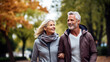 © PaulShlykov - Happy senior couple in autumn park