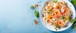 Seafood spaghetti with creamy sauce Mediterranean style prawns macro view blue table Italian cuisine With copyspace for text