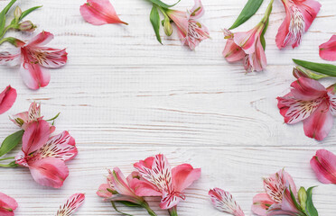 Wall Mural - Beautiful Alstroemeria flowers on wooden background