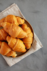 Wall Mural - Homemade Croissants on a Plate, top view. Flat lay, overhead, from above.