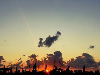 Wall Mural - sea beach under sunset sky with sun and cloud. sunrise horisont skyline background