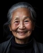 © DIGITALSHAPE - Portrait of an elderly asian woman on a black background. Created with Generative AI tools