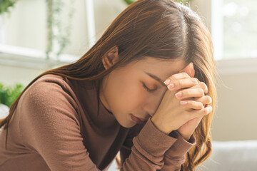 Wall Mural - Believe faith charity, calm asian young woman show gratitude, folded hands in prayer feel grateful, meditating with her eyes closed, praying to request God for help. Religious, forgiveness concept.