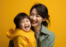 Happy Vogue Fashion Mother Wearing Lovingly Embracing Her Kid, Bright Solid Light Background