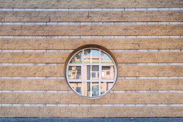 Poster - Urban architecure. Stone wall with round window.