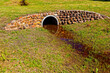 Description
Concrete culvert forming a grassy bridge over a drainage ditch with rock cladding near Riversdale in the Western Cape, South Africa