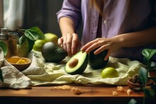 woman preparing avocado to eat in the kitchen