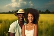 © Jorge Ferreiro - young black couple walking through a green field