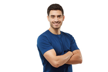 Wall Mural - Portrait of smiling handsome man in blue t-shirt standing with arms crossed