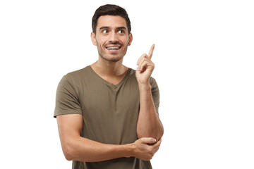 Wall Mural - Portrait of young handsome man in t-shirt, pointing his finger in eureka sign, having great idea, understanding solution