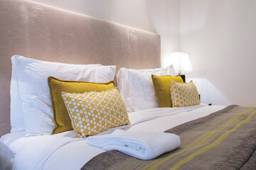 Poster - Stylish interior of contemporary room with comfortable bed