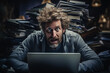 Stressed man madly working on laptop disheveled hair in chaos 
