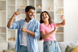 © Prostock-studio - Joyful hindu spouses dancing in living room interior at home, husband and wife enjoying spending time together
