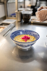 Wall Mural - Chef making japanese ramen noodle soup in restaurant