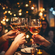 Selective focus at wine glass in hands, cheer and toast, blur and defocus background of interior bar vibe with golden bokeh.

