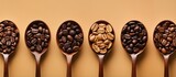 Bird s eye view of coffee beans in a small bowl with a spoon representing the concept of coffee