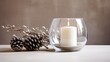  a candle is lit in a glass vase with a pine cone.  generative ai