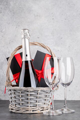 Wall Mural - Basket with Christmas gift boxes, champagne