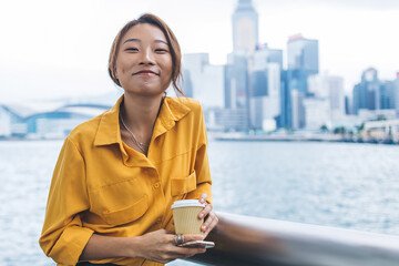 Wall Mural - Content Asian woman smiling at camera