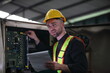 © sittinan - worker or engineer working in factory with safety uniform , safety hat and safety glasses , image is safety concept or happy workplace