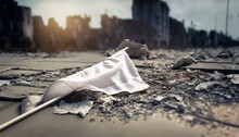White Flag Lying On The Ground In The Destroyed War City