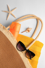 Canvas Print - Flat lay composition with sunscreen and beach accessories on white background