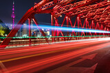 Fototapeta  - a famous bridge of The Bund in Shanghai at night and beautiful light trail at highway