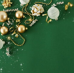 Wall Mural - Christmas background template top view with copy space. Golden Xmas decor frame on green backdrop .Beautiful Xmas greeting card.New Year decor frame mockup .