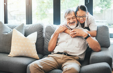 Poster - Home, hug and old couple on a couch, marriage and love with retirement, smile and commitment. Apartment, senior man or mature woman on sofa, speaking and support with relationship, embrace or bonding