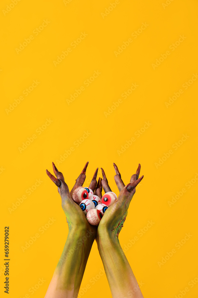 Witch with eyeballs on yellow background. Halloween celebration