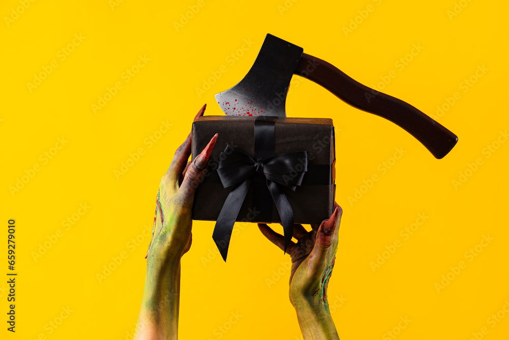 Witch with gift on yellow background. Halloween celebration