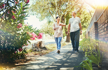 Canvas Print - Street, neighborhood and senior couple walking as fitness , exercise and outdoor workout together as wellness. Health, time and calm elderly people on retirement training muscle or sport freedom