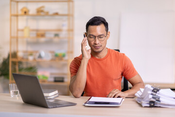 Wall Mural - Happy business man work on laptop for email update, online project and reading digital report with mockup space. freelance asian man  entrepreneur and working from home research, planning and info 