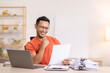 © David - Excited Asian man sit at desk feel euphoric win online lottery, happy asian man overjoyed get mail at laptop being promoted at work, biracial man good news at computer