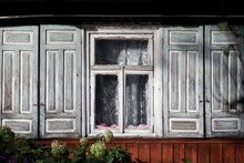 Wooden Window Background. Rustic Cottage House Wall. Vintage Cabin White Paint Shutters. Countryside Architecture Texture. Rustic Architecture. Village In Eastern Europe - Poland. Sunlight Window.