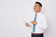 © Bangun Stock Photo - Portrait of smiling happy young Asian man in formal wear holding digital tablet and looking at side copy space for advertisement isolated on white background
