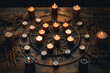 lit candles are arranged in the shape on a wooden table during an occult ritual ceremony