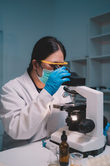 two scientists looking through a microscope an ecological skin care experiment in a night lab develo